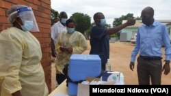 Chitungwiza Municipality Director of Health and Environmental Services Dr Kasu getting vaccinated at Seke South Clinic