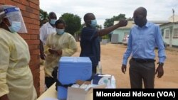 Chitungwiza Municipality Director of Health and Environmental Services Dr Kasu getting vaccinated at Seke South Clinic