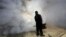 A municipal worker carries out fumigation to help control the spread of the mosquito-borne Zika virus in Caracas, Venezuela, Jan. 28, 2016. 