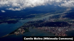 The Pacific Ocean entrance of the Panama Canal is seen on March 16, 2012, with Panama City in the foreground and the Bridge of the Americas over the canal.