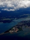 The Pacific Ocean entrance of the Panama Canal is seen on March 16, 2012, with Panama City in the foreground and the Bridge of the Americas over the canal.