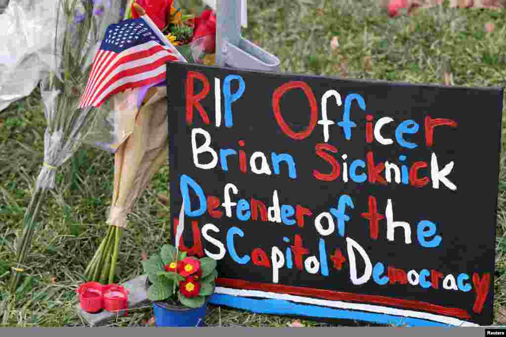 Items are left to memorialize slain U.S. Capitol Police officer Brian Sicknick, who died from injuries sustained during the attack at the Capitol on Jan. 6, 2021, in Washington, D.C.