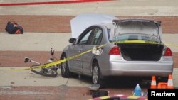 FILE - A car that police say was used by an attacker to plow into a group of students is seen outside Watts Hall on Ohio State University's campus in Columbus, Ohio, Nov. 28, 2016. (Courtesy of Mason Swires/thelantern.com)