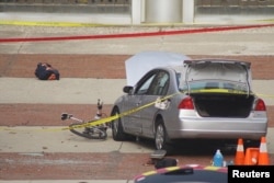 A car which police say was used by an attacker to plow into a group of students is seen outside Watts Hall on Ohio State University's campus in Columbus, Ohio, Nov. 28, 2016. (Courtesy of Mason Swires/thelantern.com)