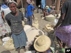 Rice merchants at local markets in Haiti say food aid cut into prices and sales.