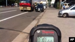 Safecast contributor Pieter Franken takes a mobile probe radiation measurement in Japan.