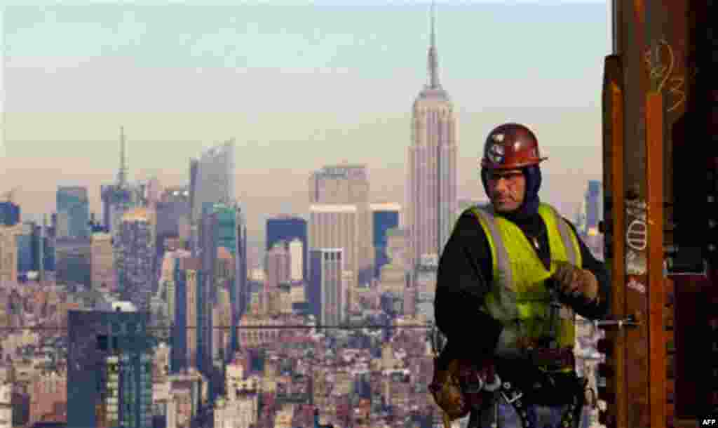 An ironworker looks at the New York skyline while working on a steel column for the 52nd floor of One World Trade Center, Thursday, Dec. 16 in New York. The tower is halfway to the 104 floors it will have upon completion, scheduled for 2013.
