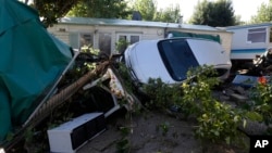 Debris and a damaged car are pictured in the campsite of Biot, near Cannes, southeastern France, Oct. 4, 2015. 