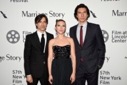 Director, screenwriter and producer Noah Baumbach, left, poses with actors Scarlett Johansson and Adam Driver at he "Marriage Story" premiere during the 57th New York Film Festival at Alice Tully Hall on Friday, Oct. 4, 2019, in New York.