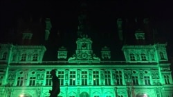 The City Hall of Paris, France is illuminated in green, June 1, 2017, following the announcement by US President Donald Trump that the United States will withdraw from the 2015 Paris accord and try to negotiate a new global deal on climate change.