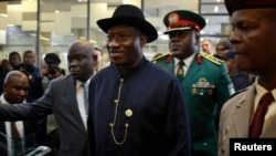 Nigeria's President Goodluck Jonathan arrives for service for former South African President Nelson Mandela, First National Bank Stadium, Johannesburg, Dec. 10, 2013.