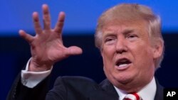 Republican presidential candidate Donald Trump gestures as he speaks to the American Legion National Convention, Thursday, Sept. 1, 2016, in Cincinnati. 