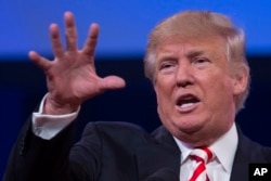 Republican presidential candidate Donald Trump gestures as he speaks to the American Legion National Convention, Thursday, Sept. 1, 2016, in Cincinnati.