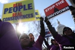 Federal air traffic controller union members protest the partial U.S. federal government shutdown in a rally at the U.S. Capitol in Washington, Jan. 10, 2019.