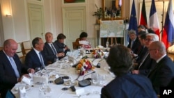 Sergei Lavrov, 2nd left, Foreign Minister of Russia, Jean-Marc Ayrault, 3rd left, Foreign Minister of France, Pavlo Klimkin, 3rd right, Foreign Minister of Ukraine and Frank-Walter Steinmeier, 2nd right, Foreign Minister of Germany are seen prior to talks at the German Foreign Ministry's guest house Villa Borsig in Berlin, May 11, 2016. 