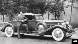 Actor Clark Gable poses in this 1932 photo with his Packard automobile. (AP Photo)