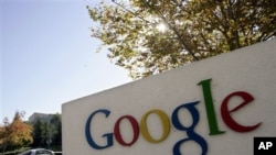 FILE - Google signage is seen at the company's headquarters in Mountain View, California. 