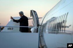 U.S. Secretary of State John Kerry boards his plane to Germany at Joint Base Andrews, Md., Wednesday, Oct 21, 2015.