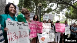 Activist Dolores Huerta (L) attends a rally protesting Brunei's new strict sharia law penal code outside the Beverly Hills Hotel, which is owned by the Sultan of Brunei, in Beverly Hills, California, May 5, 2014.