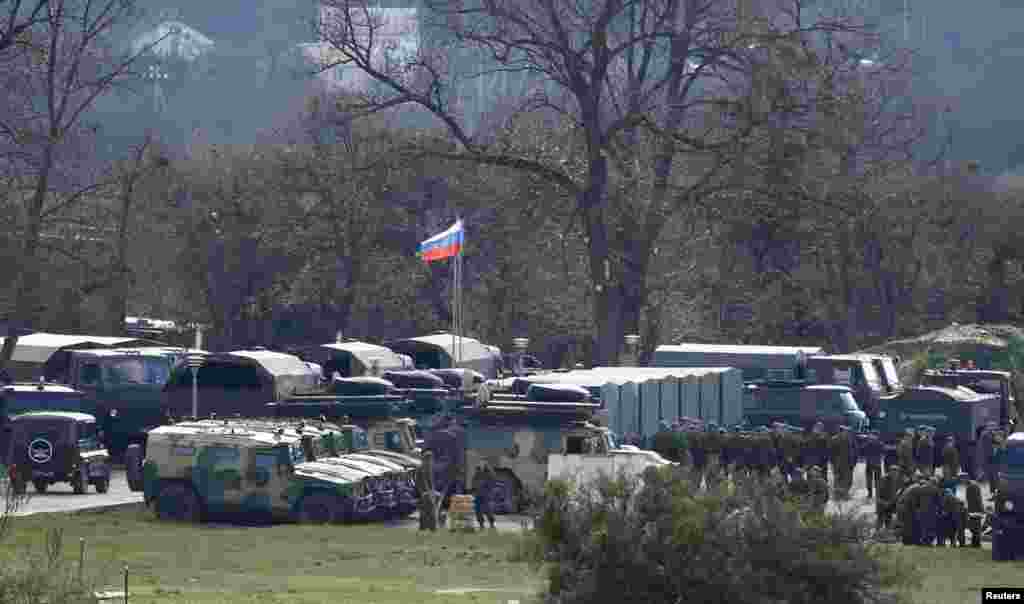 Russian troops and vehicles are seen at a military base in Perevalnoye, near the Crimean city of Simferopol, Crimea, March 27, 2014. 