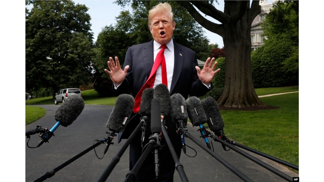 President Donald Trump speaks to the media on the South Lawn of the White House in Washington, May 23, 2018, en route to a day trip to New York.