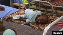 FILE - A child who sustained brain damage resulting from cerebral spinal meningitis is seen at the Save the Children stabilization ward in Maiduguri, Nigeria, Nov. 30, 2016.