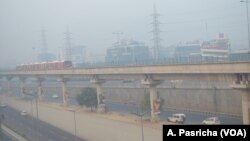 FILE - As pollution levels spike, Delhi and its satellite towns are enveloped in a haze of smog on Oct. 30, 2018. 