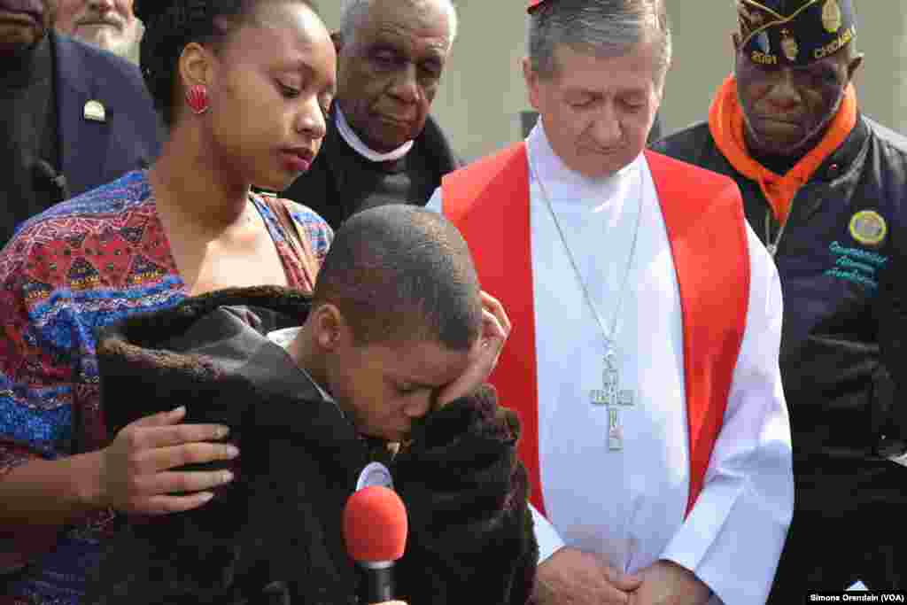 A young man makes a heartfelt plea for an end to shootings in his neighborhood, Englewood, as Chicago area church leaders look on, April 14, 2017.