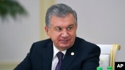 FILE - Uzbekistan's President Shavkat Mirziyoyev attends the meeting of the heads of CIS states in Ashgabat, Turkmenistan, Oct. 11, 2019. Uzbekistan's president is expected to win a new term by a landslide against weak competition in an election Sunday. 