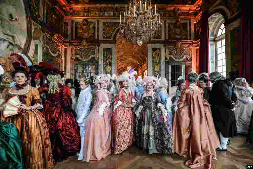 People dressed in period costumes take part in the &quot;Fetes Galantes&quot; fancy dress evening at the &quot;galerie des glaces&quot; in the Chateau de Versailles, France, May 27, 2019.