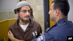 Head of a Jewish extremist group Meir Ettinger appears in court in Nazareth Illit , Israel, Aug. 4, 2015.