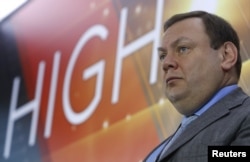 FILE - Mikhail Fridman, chairman of the supervisory board of the Alfa Group Consortium, attends a ceremony at the Moscow Exchange in Moscow, Russia Feb. 1, 2018.