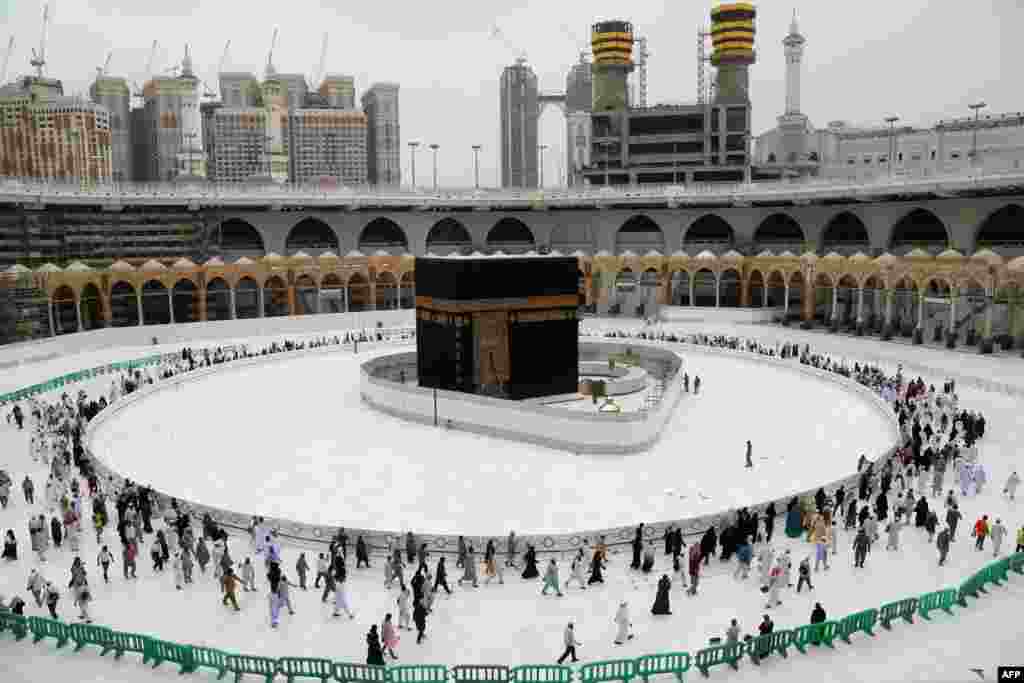 Muslim worshippers circumambulate the sacred Kaaba in Mecca&#39;s Grand Mosque, Islam&#39;s holiest site, in Saudi Arabia. 