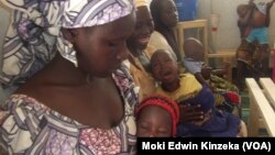 Aissatou Jowel, left, lives with her children at the refugee camp in Minawao, Cameroon. She says it would be too painful to return to her home in northern Nigeria, where Boko Haram rebels killed her husband. (Moki Edwin Kinzeka / VOA) 