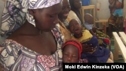 Aissatou Jowel, left, lives with her children at the refugee camp in Minawao, Cameroon. She says it would be too painful to return to her home in Nigeria, where Boko Haram rebels killed her husband. (Moki Edwin Kinzeka / VOA) 