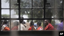 Masaai line up to vote in a general election outside an elementary school in Kumpa, Kenya, March 4, 2013.