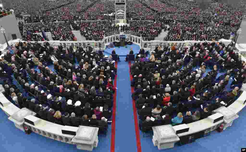 Vice President Joe Biden, left and President Barack Obama wait for their ceremonial swearing-in at the U.S. Capitol during the 57th Presidential Inauguration in Washington, Jan. 21, 2013.