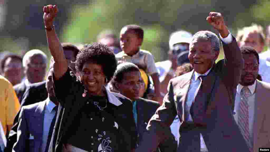 Nelson Mandela and his then wife, Winnie, salute well-wishers as he leaves Victor Verster prison on February 11, 1990. 