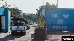 FILE - U.N. peacekeepers drive into their compound in the capital Kinshasa, in the Democratic Republic of Congo, April 10, 2017. A Malawian peacekeeper who died saving the life of a fellow soldier was honored Friday.