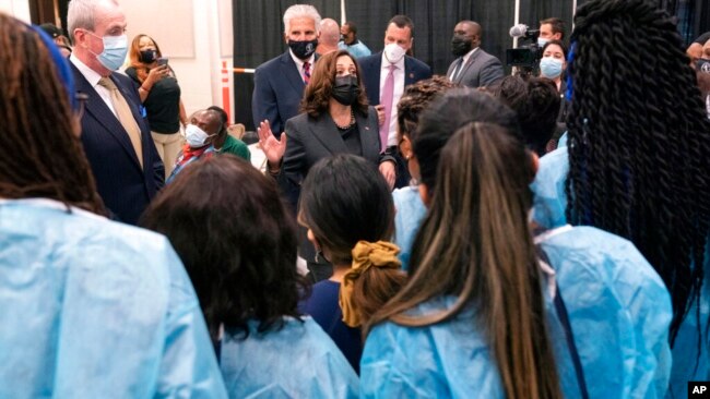 Vice President Kamala Harris talks with people who have been administering COVID-19 vaccinations, in Newark, NJ, Oct. 8, 2021.