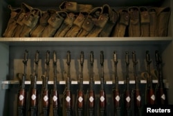 FILE - Kalashnikov rifles are seen in a trench at the Armenian positions near Nagorno-Karabakh's town of Martuni, April 8, 2016.