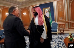 U.S. Secretary of State Mike Pompeo shakes hands with the Saudi Crown Prince Mohammed bin Salman in Riyadh, Saudi Arabia, Oct. 16, 2018.