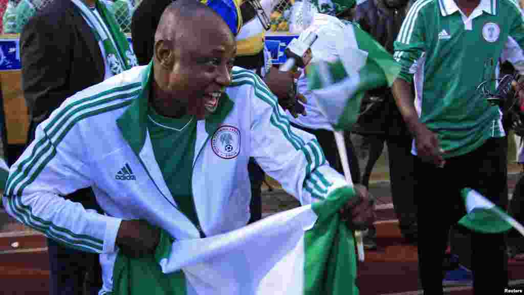 Supporters of Nigeria's national football team celebrate their 2 -1 victory over Ethiopia in their 2014 World Cup qualifyingmatch.