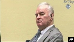 FILE - А Dec. 5, 2016, file photo taken from video shows former Bosnian Serb military commander Gen. Ratko Mladic as he looks across the court room at the International Criminal Tribunal for the Former Yugoslavia in The Hague Netherlands.
