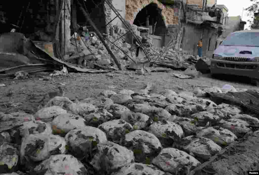 Stacks of bread are seen at a damaged site after an airstrike in the rebel-held Bab al-Maqam neighborhood of Aleppo, Syria, Sept. 28, 2016.