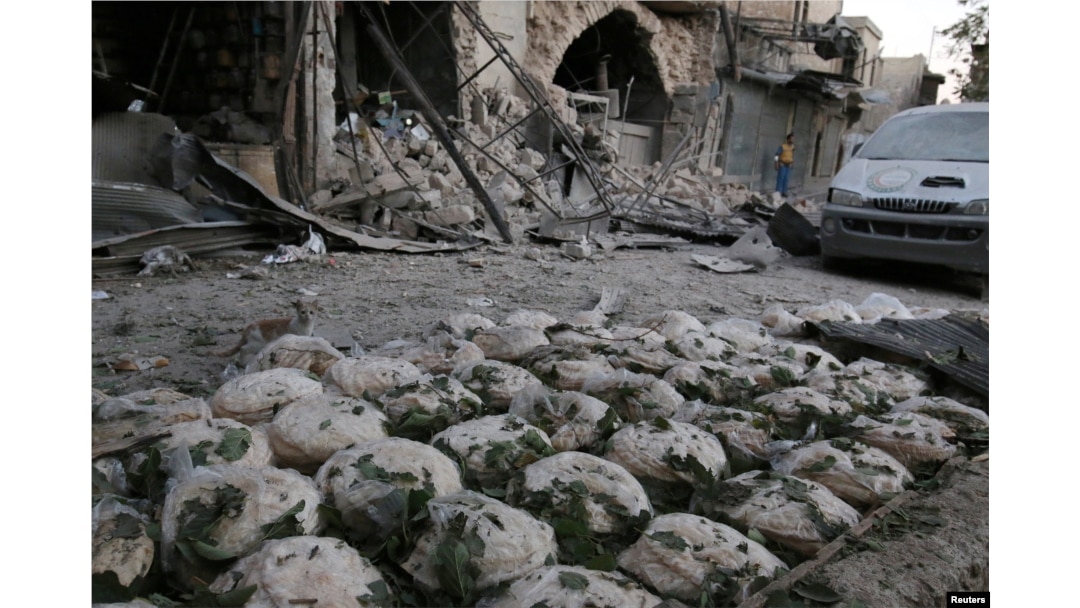 Stacks of bread are seen at a damaged site after an airstrike in the rebel-held Bab al-Maqam neighbourhood of Aleppo, Syria, Sept. 28, 2016.