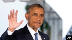 President Barack Obama, waves as he leaves the White House in Washington, July 23, 2015, for a trip to trip to Kenya and Ethiopia.