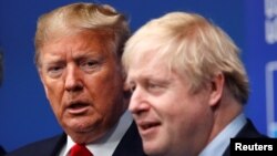 El presidente Donald Trump y el primer ministro británico Boris Johnson, durante la más reciente reunión de la OTAN. Foto REUTERS/Peter Nicholls/Pool.