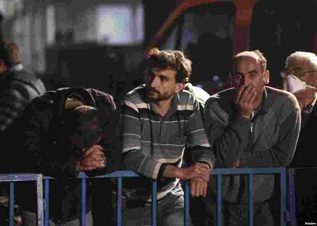 Relatives of miners trapped in a coal mine wait in front of the site in Soma, western Turkey, May 14, 2014.