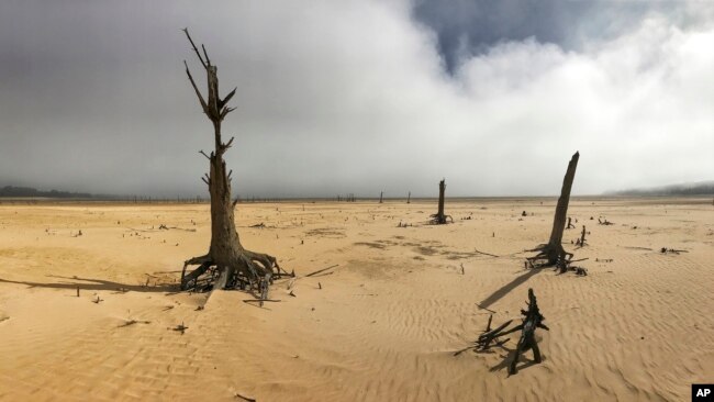 FILE - The Theewaterskloof Dam, a key source of water supply to Cape Town, South Africa, is shown at low levels on April 16, 2017.